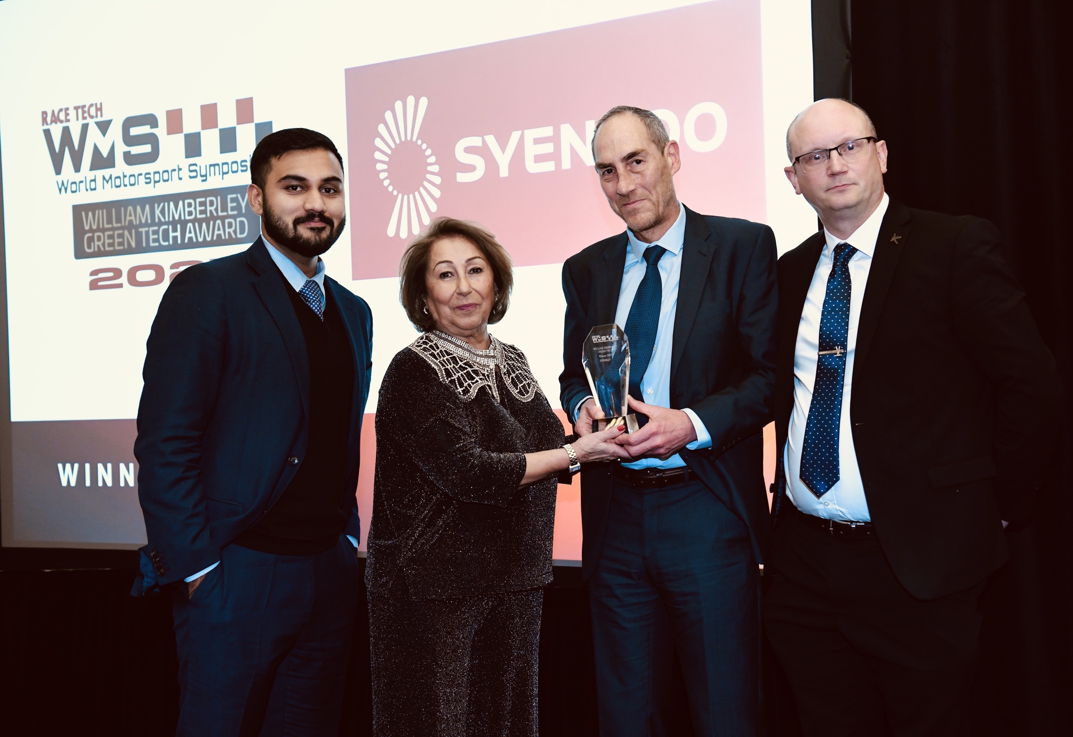 Gaurav Unni, Global Sales Leader Automotive Composites; Mark Steele, Automotive Customer Engineering Manager; and Mark Harriman, Head of Emerging Markets & Technology R&I, receive the Green Tech Award for Syensqo’s bio-based MTM® 49-3.