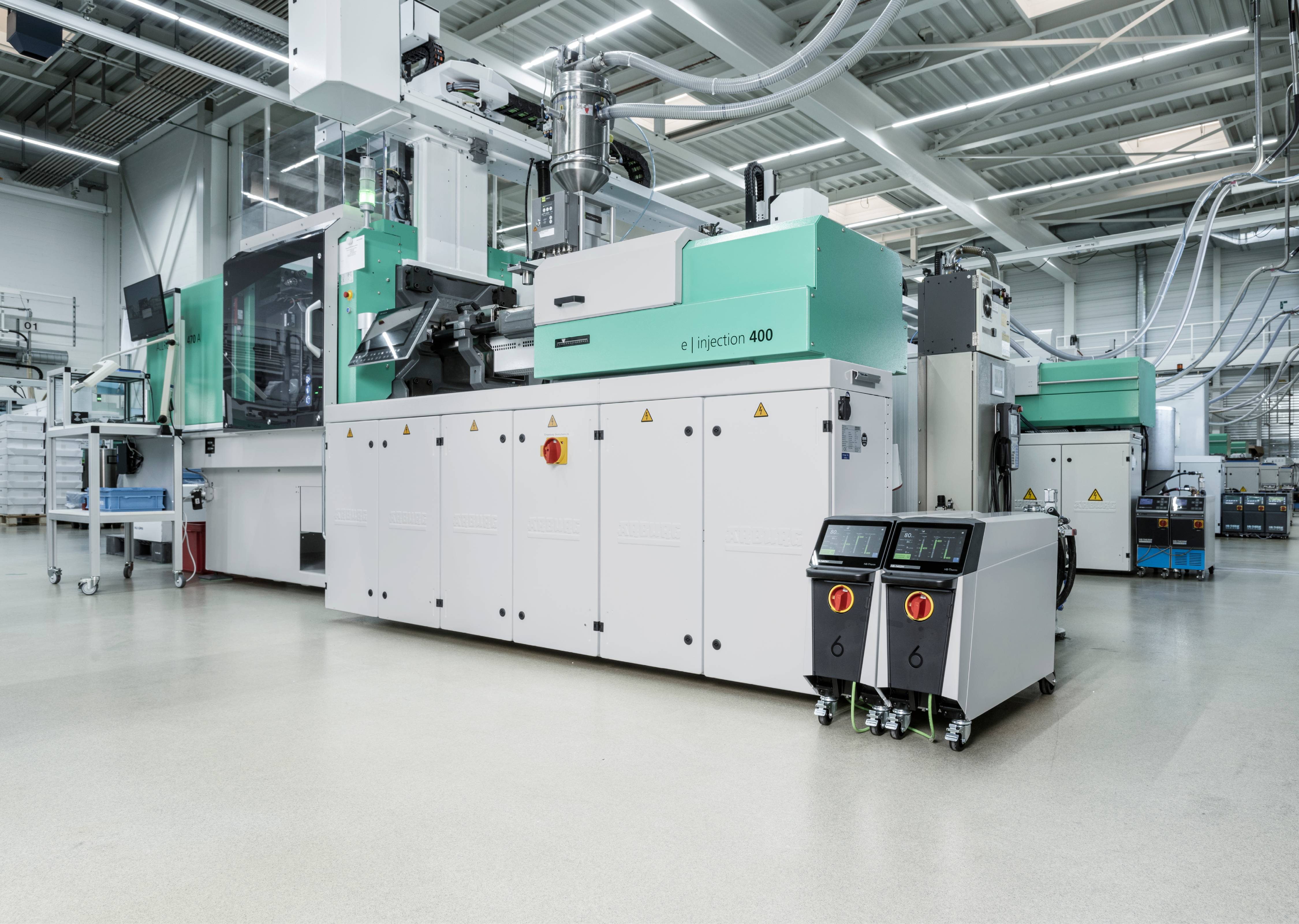Allrounder injection moulding machine equipped with HB-Therm Thermo-6 temperature control units.